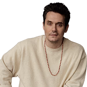 John Mayer wearing a cream-colored sweater and a long beaded necklace.