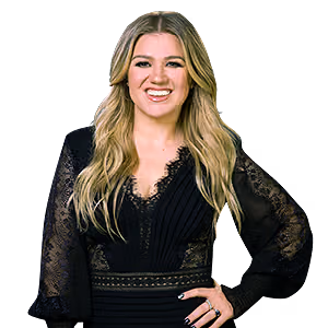 Kelly Clarkson smiling, wearing a black long-sleeved dress with lace detailing.